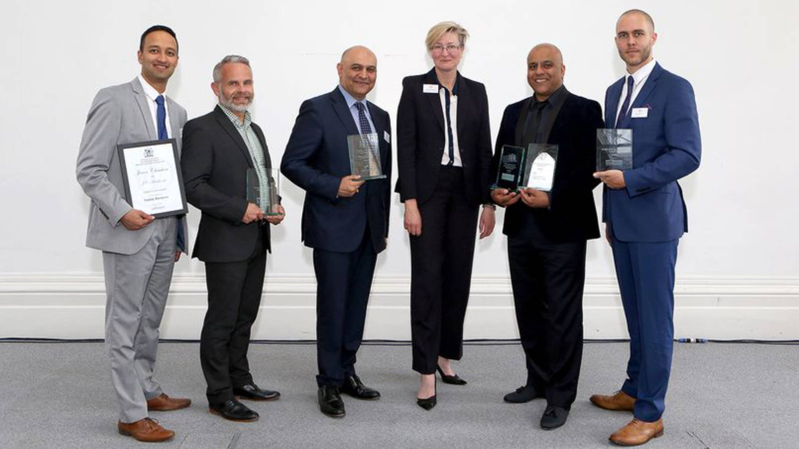 Dr Nik Kotecha OBE winning three IoD (Institute of Directors awards).